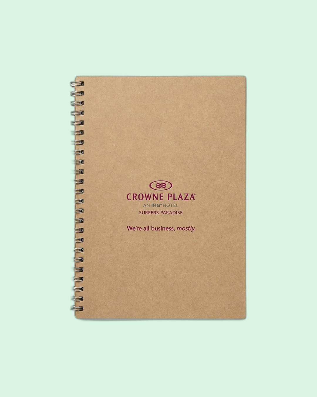Crowne Plaza Surfers Paradise — Recycled spiral notebook with 'We're all business, mostly.' line