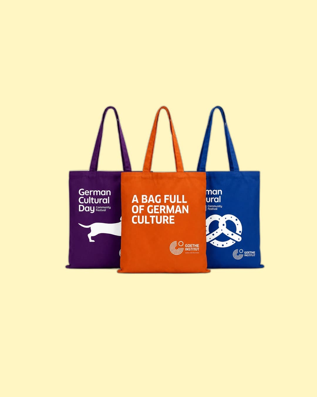 Goethe-Institut — German-Culture canvas tote trio (purple, orange, blue)