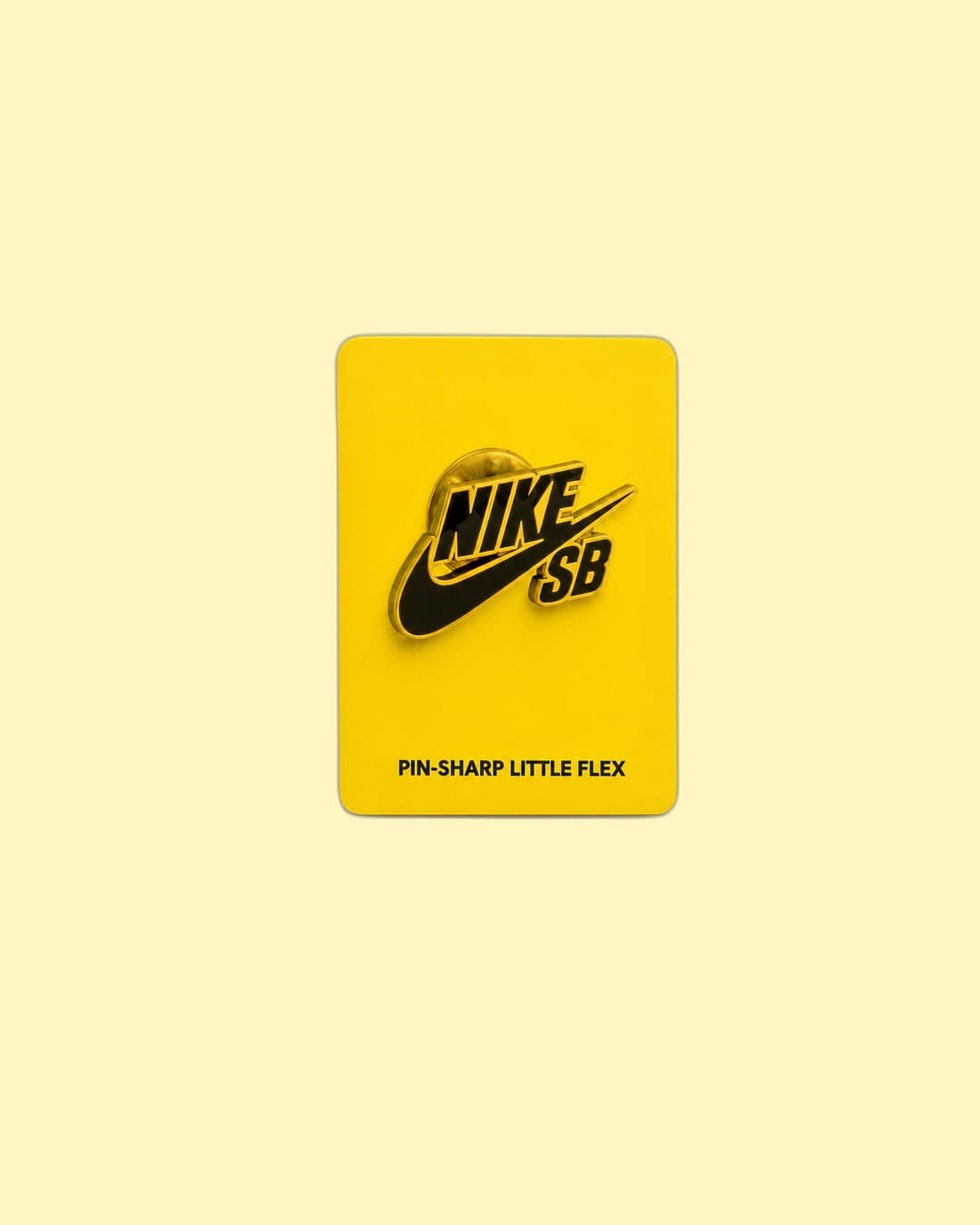 Nike SB — Gold-enamel Nike SB die-cut lapel pin on backing card